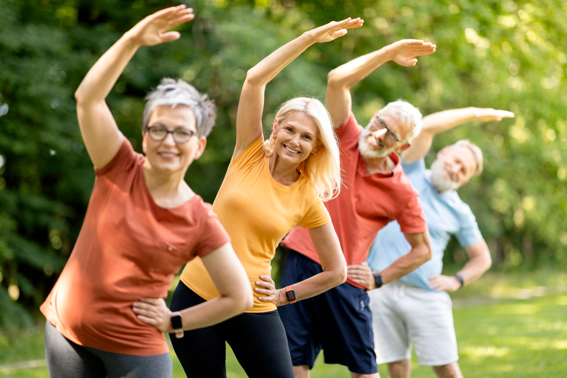 An active couple in their 60s strength training together